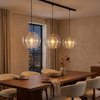 Three Marlowe pendants above a walnut dining table