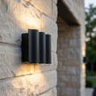 Close detail of the Verano wall light on stone