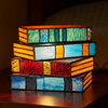 Close detail of the stained glass panels glowing