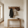 Sonata coat rack in a hallway with coats hanging
