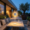 Halden lamp on an outdoor terrace table at dusk