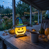 Bramwell Halloween Pumpkin Light Witch Hat LED Lamp on a covered porch table at dusk